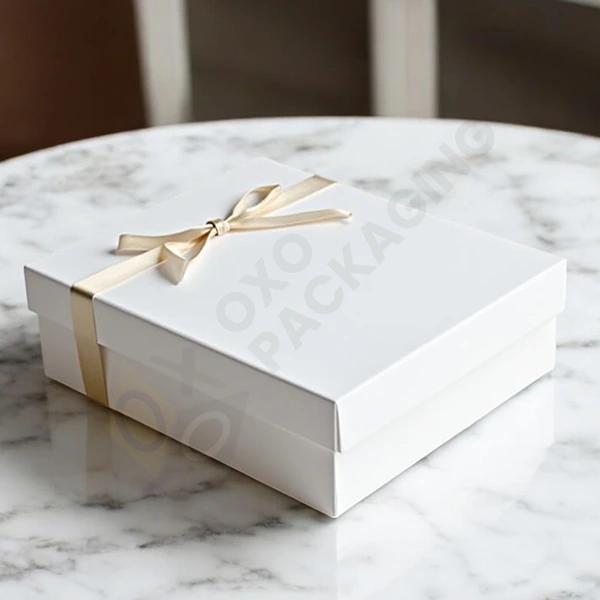 sturdy white gift boxes with ribbon